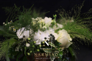 Small basket with bouquet of white flowers