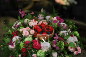 Basket of seasonal flowers and fruits