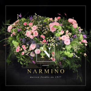 Basket of pink seasonal flowers by Narmino