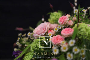 Small basket of Pastel colored seasonal flowers