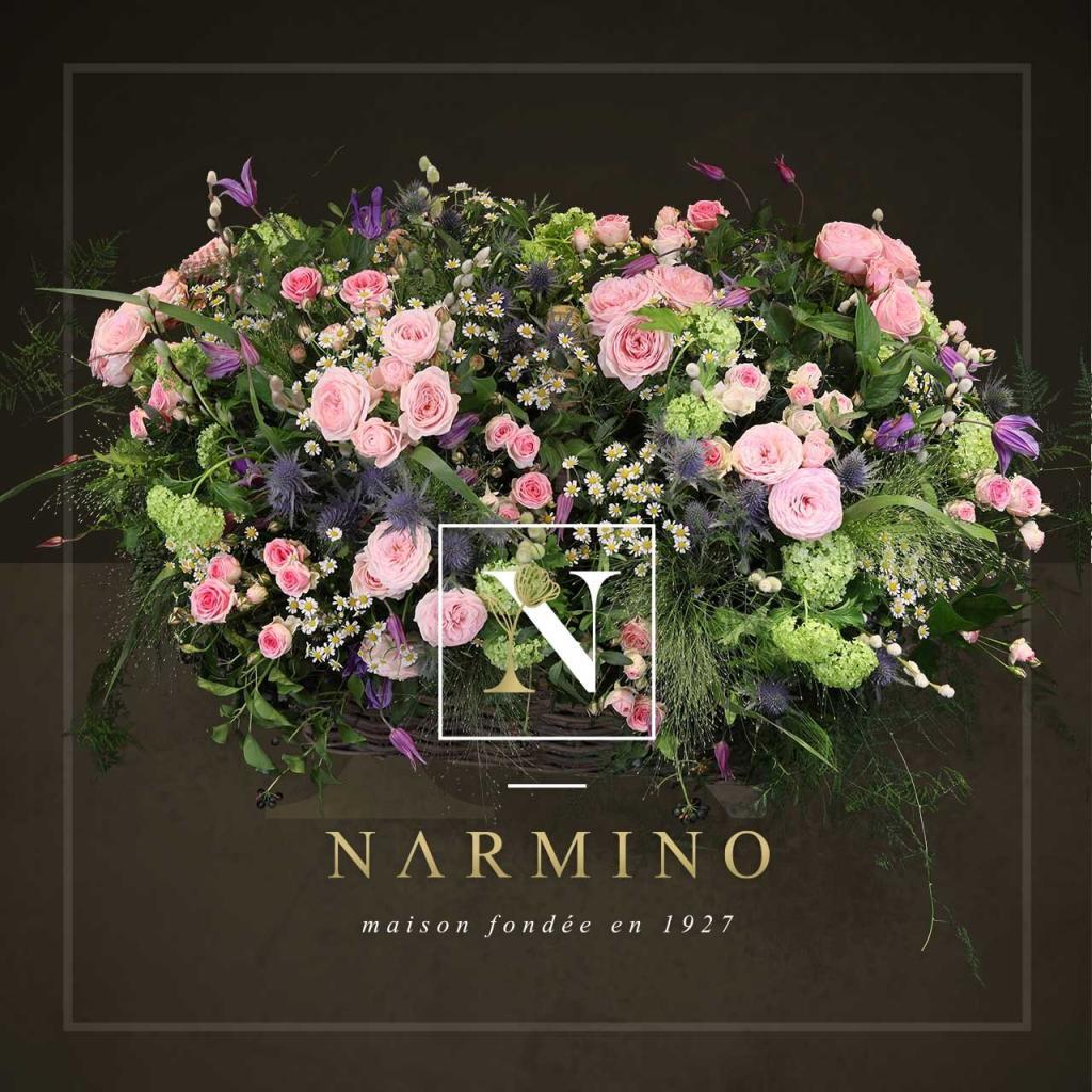 Basket of pink seasonal flowers by Narmino