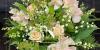 Bouquet made up of sprigs of lily of the valley and pink sweet peas