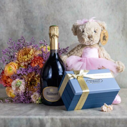 The Prestige kit contains a bottle of Ruinart champagne, chocolates from the Monaco Chocolaterie, and a plush toy